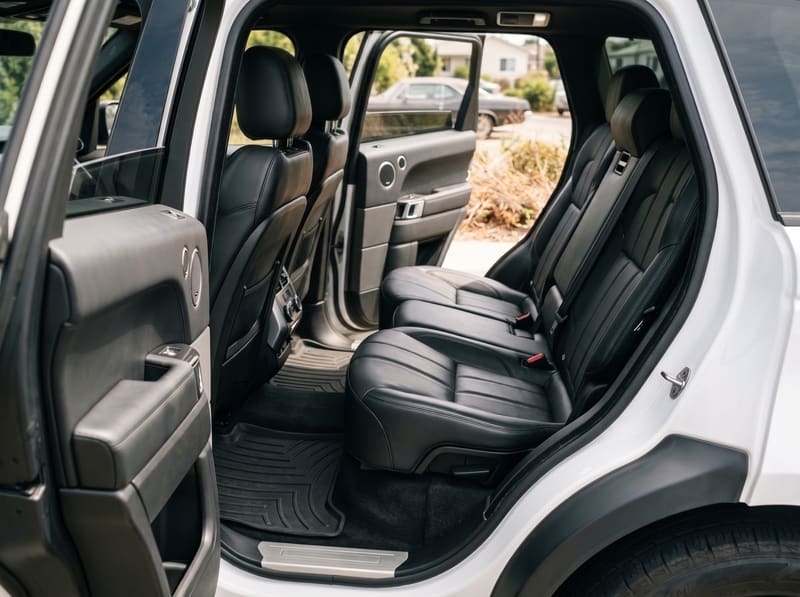 Car detailing near me in Los Angeles: the rear seats and floor mats of a white Range Rover, clean after an interior detail