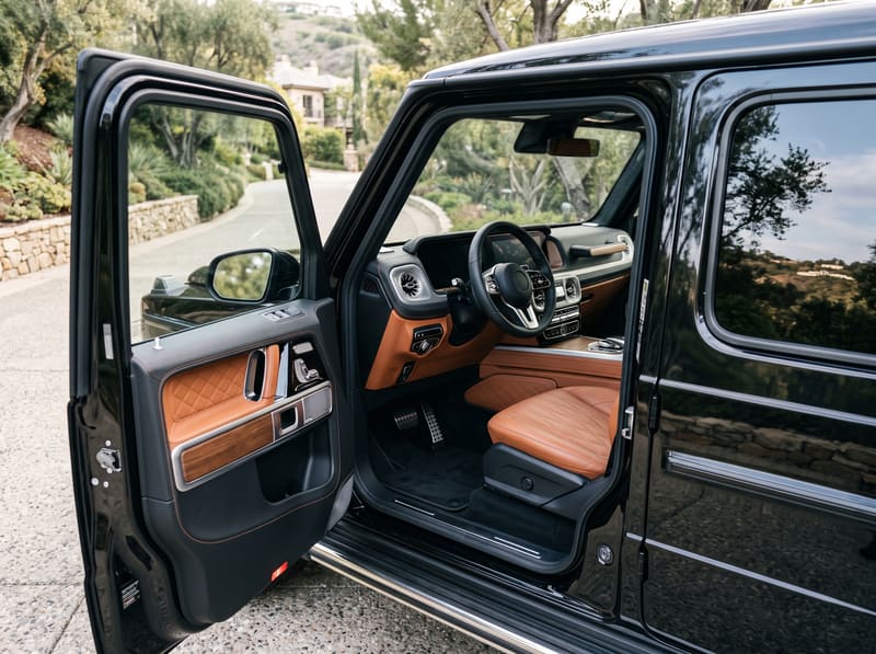 Interior car detailing in Los Angeles: the front cabin of a black Mercedes G-Class, clean after interior detailing